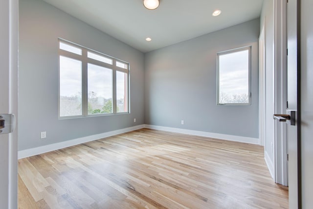 spare room with light hardwood / wood-style floors