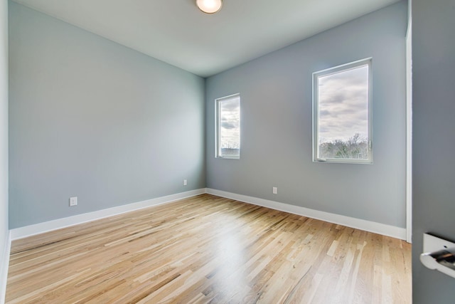 unfurnished room featuring light wood-type flooring