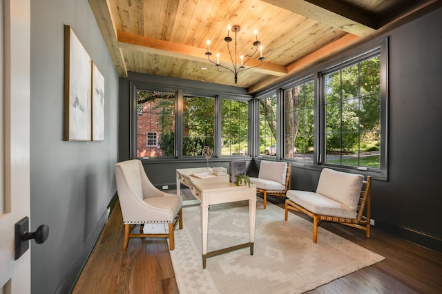 sunroom / solarium featuring beamed ceiling, a notable chandelier, and a healthy amount of sunlight