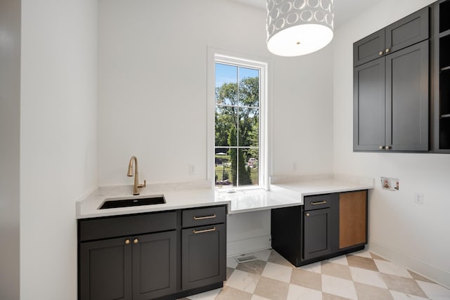 kitchen with gray cabinets and sink