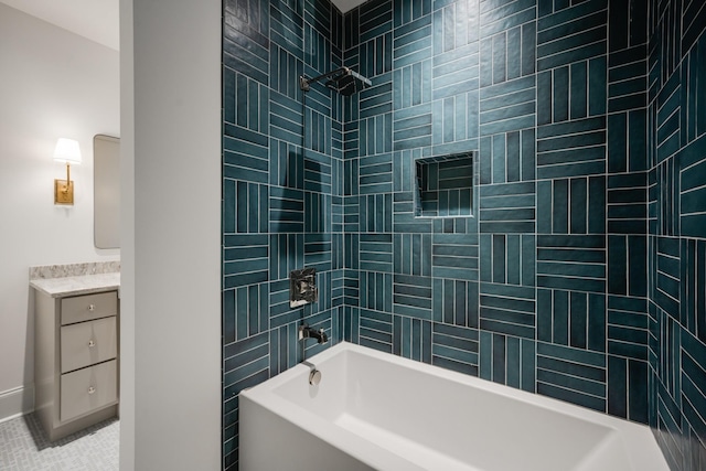 bathroom featuring tile patterned flooring and tiled shower / bath