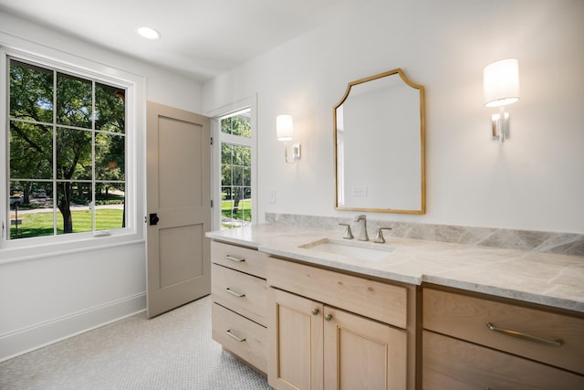 bathroom featuring tile patterned flooring and vanity