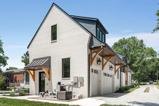 view of side of home with a garage