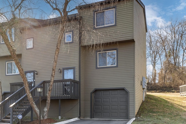 back of house featuring a garage