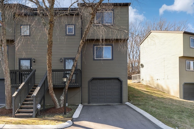 back of property featuring a garage