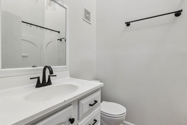 bathroom with vanity and toilet