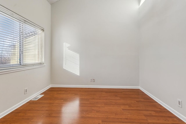 empty room featuring hardwood / wood-style floors