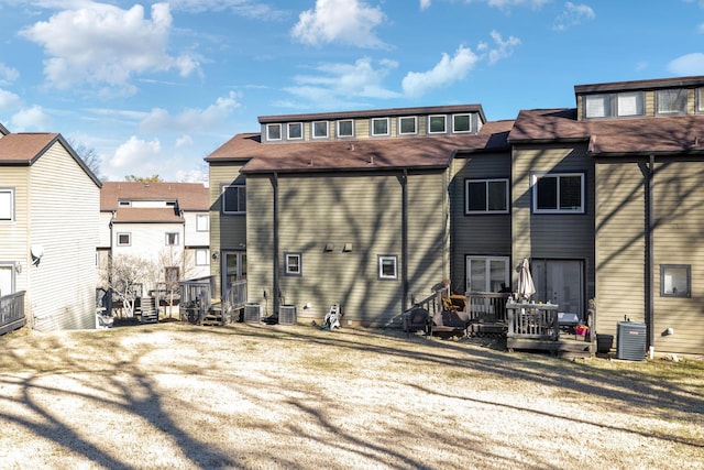 rear view of house with central air condition unit