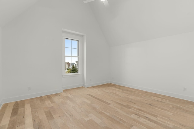 bonus room with light hardwood / wood-style floors, high vaulted ceiling, and ceiling fan