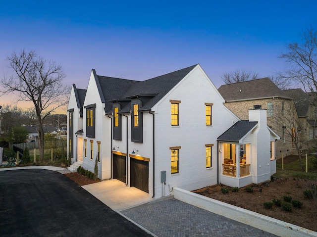 property exterior at dusk with a garage