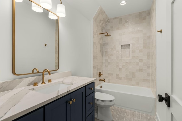 full bathroom with toilet, vanity, and tiled shower / bath combo