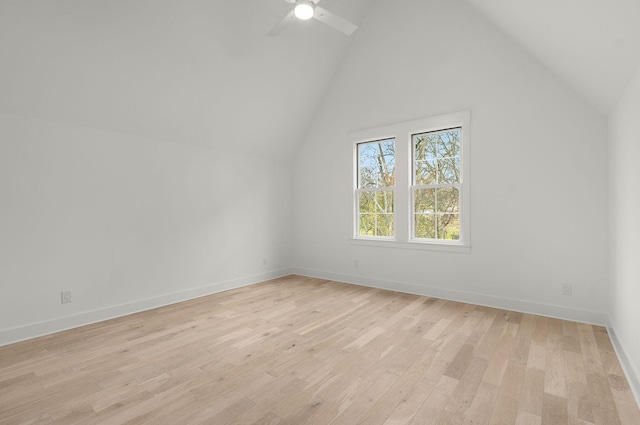 additional living space featuring ceiling fan, light hardwood / wood-style floors, and vaulted ceiling