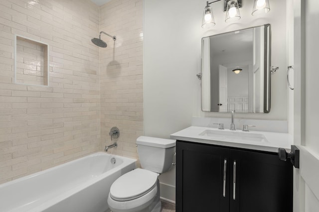 full bathroom featuring vanity, toilet, and tiled shower / bath combo