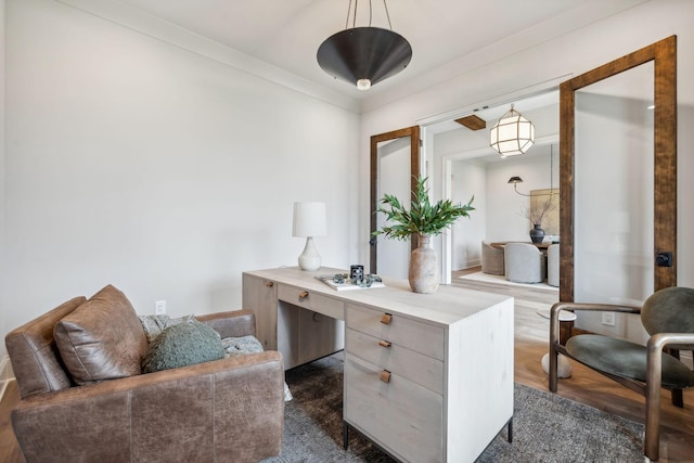 office space with crown molding and dark wood-type flooring