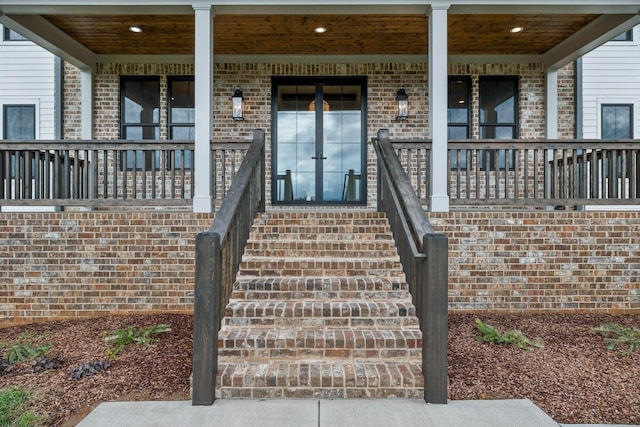 property entrance featuring covered porch