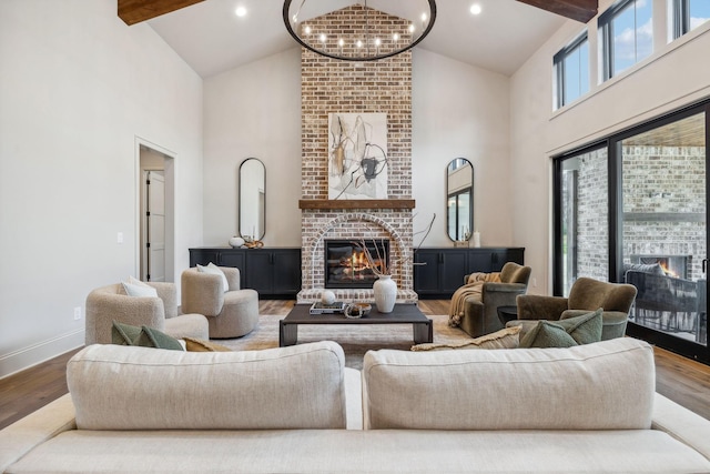 living room with a healthy amount of sunlight, a fireplace, and hardwood / wood-style floors