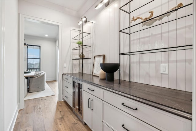 bathroom featuring vanity, wood-type flooring, and beverage cooler