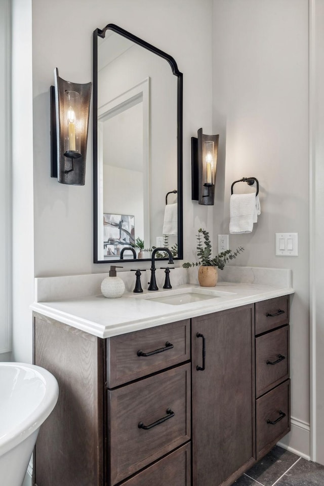 bathroom with tile patterned flooring, vanity, and a tub to relax in