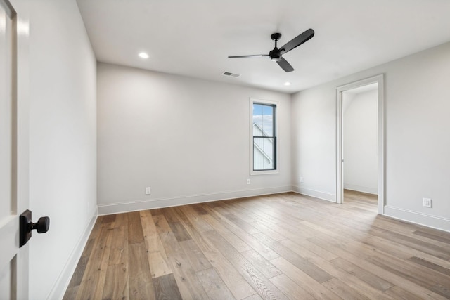 spare room featuring ceiling fan and light hardwood / wood-style flooring