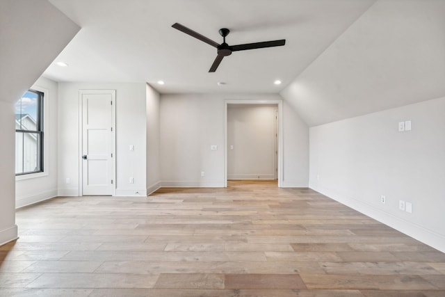 bonus room featuring ceiling fan, light wood-type flooring, and vaulted ceiling