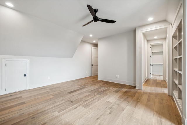 bonus room with ceiling fan, light hardwood / wood-style floors, and vaulted ceiling