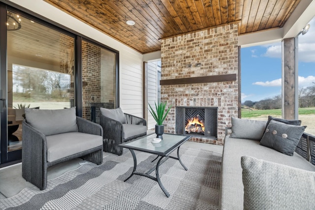 view of patio / terrace featuring an outdoor brick fireplace