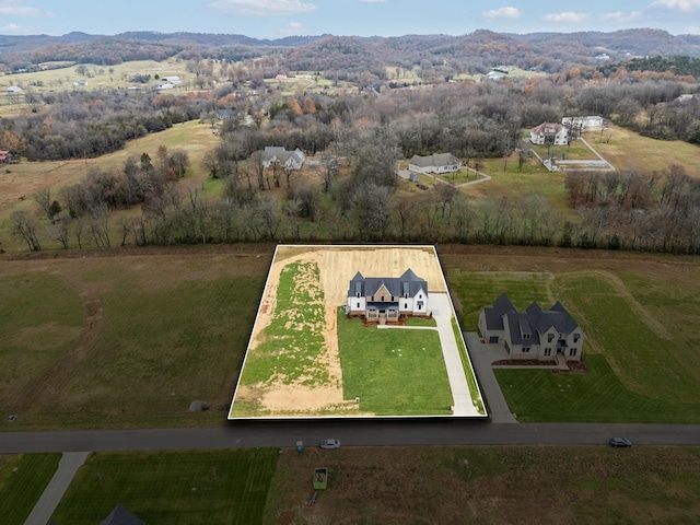 aerial view with a mountain view and a rural view