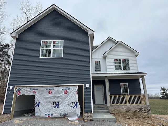 view of front of house featuring a garage and covered porch