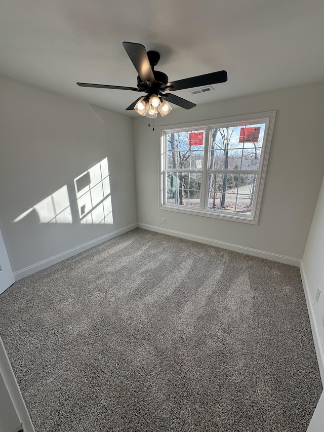 unfurnished room featuring ceiling fan and carpet flooring