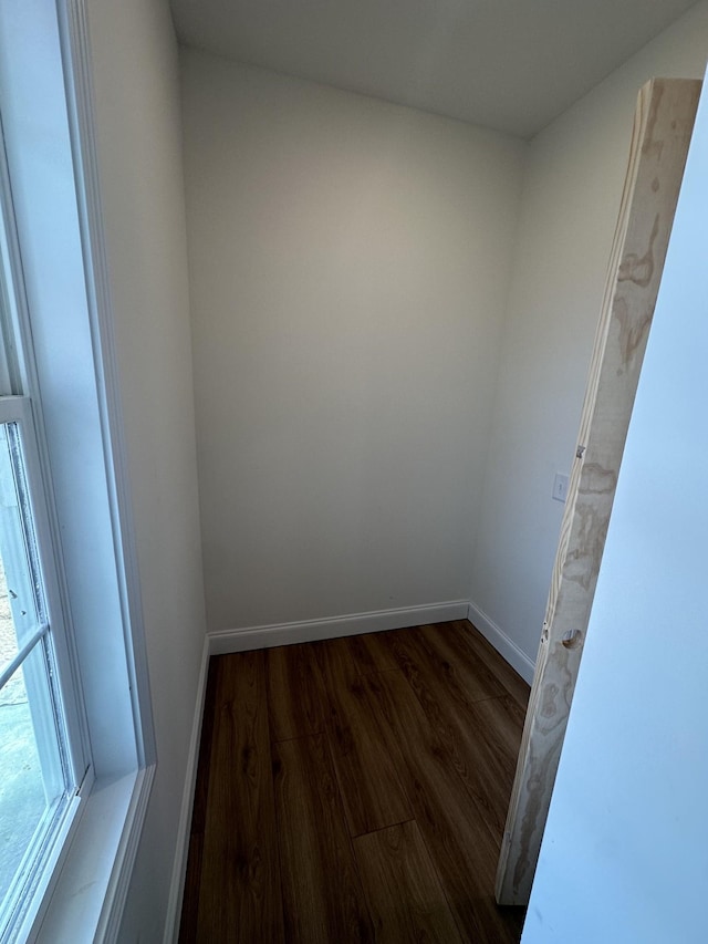 unfurnished room with dark hardwood / wood-style floors