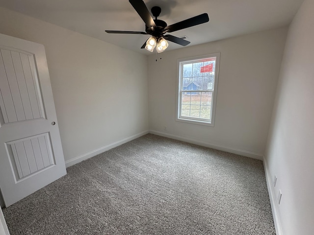 spare room featuring carpet floors and ceiling fan