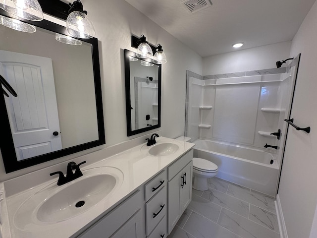 full bath with visible vents, a sink, toilet, and marble finish floor