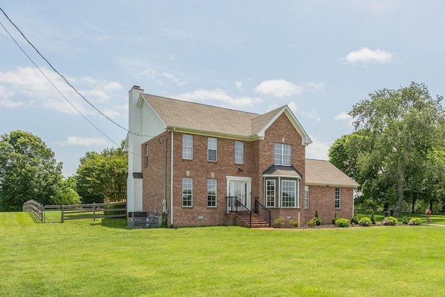 view of front of property featuring a front yard