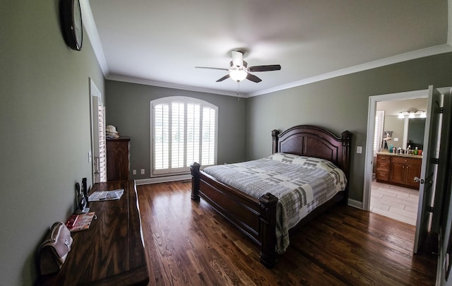 bedroom featuring ceiling fan, dark hardwood / wood-style flooring, ornamental molding, and ensuite bath