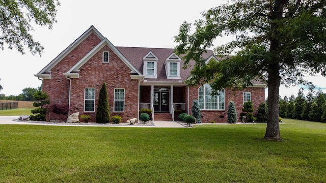 view of front of house featuring a porch and a front yard