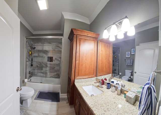 full bathroom with tile patterned flooring, crown molding, bath / shower combo with glass door, toilet, and vanity