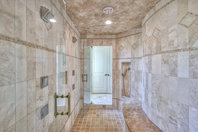 bathroom with a tile shower