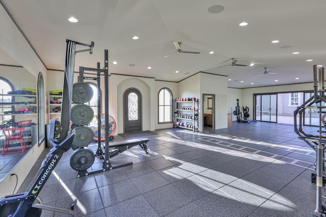 workout area with arched walkways, crown molding, lofted ceiling, recessed lighting, and ceiling fan