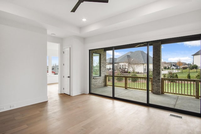 entryway with baseboards, visible vents, a residential view, wood finished floors, and recessed lighting