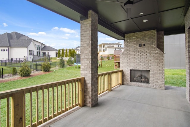 6051 Lookaway Cir, Franklin, TN 37067 - view of patio featuring a fireplace, a residential view, a trampoline, and ceiling fan