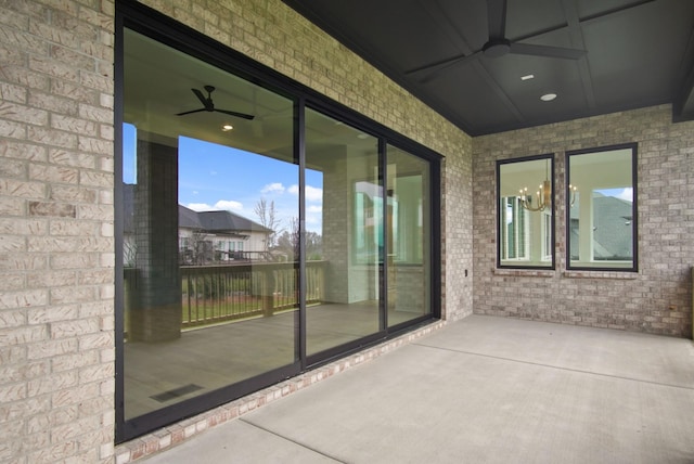 view of patio featuring ceiling fan