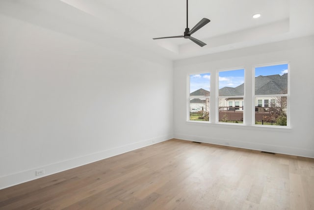 6051 Lookaway Cir, Franklin, TN 37067 - empty room with a raised ceiling, light wood finished floors, ceiling fan, and recessed lighting