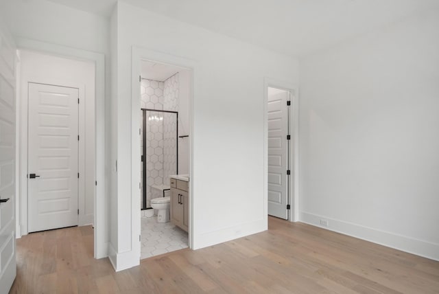 6051 Lookaway Cir, Franklin, TN 37067 - unfurnished bedroom featuring light wood-style flooring and connected bathroom