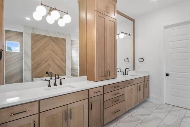 full bath featuring double vanity, marble finish floor, and a sink