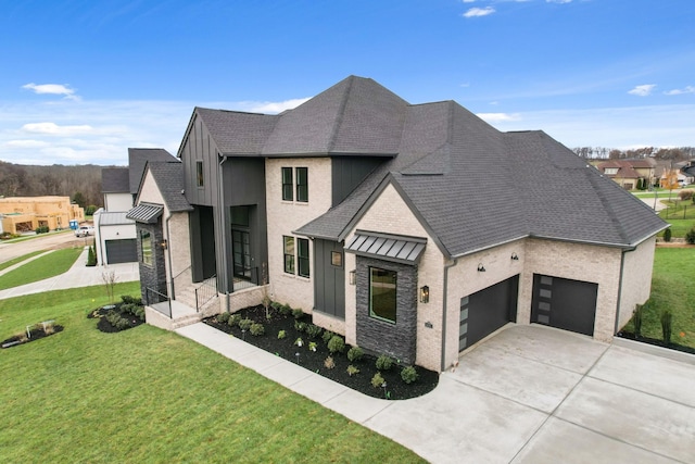 view of front of home featuring a garage and a front lawn