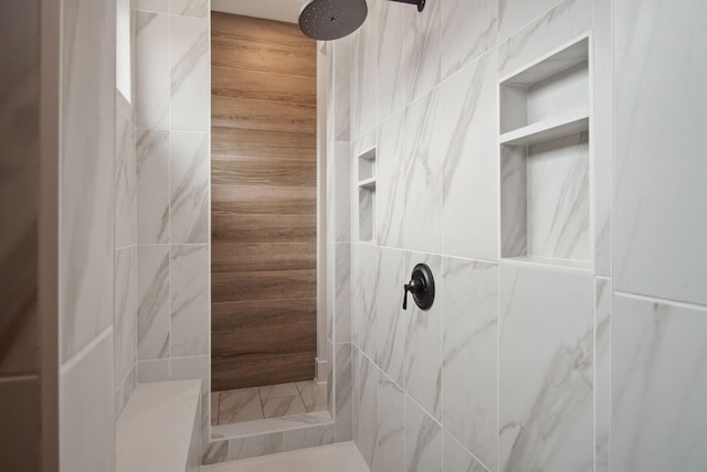 bathroom featuring a tile shower