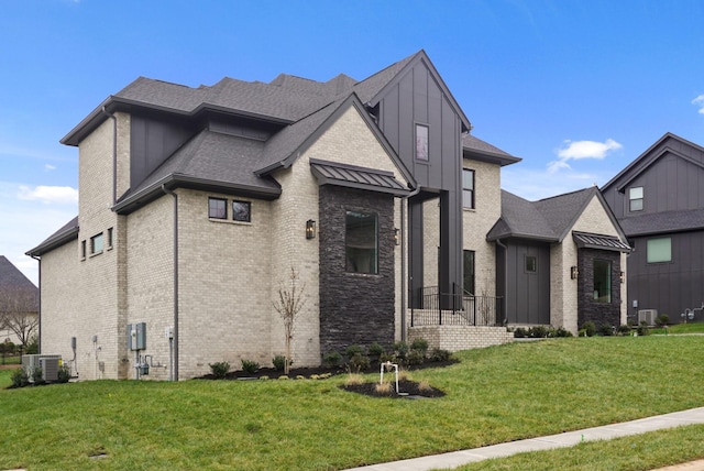 view of front of home featuring central AC and a front lawn