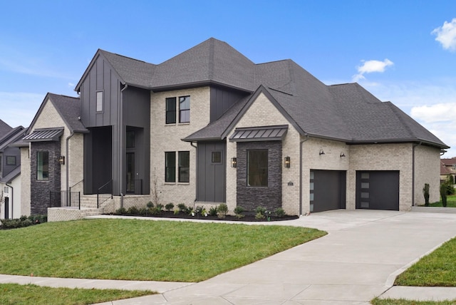 view of front facade with an attached garage, brick siding, board and batten siding, and a front yard