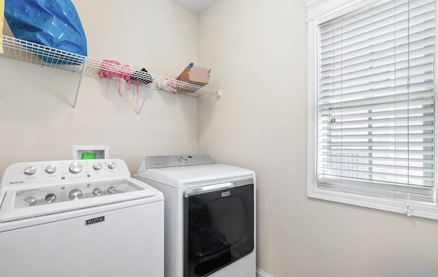 clothes washing area featuring washing machine and dryer