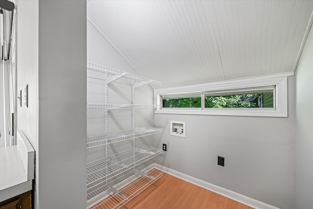 laundry room featuring hardwood / wood-style flooring and hookup for a washing machine